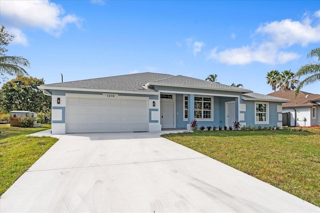 ranch-style house featuring a front yard and a garage