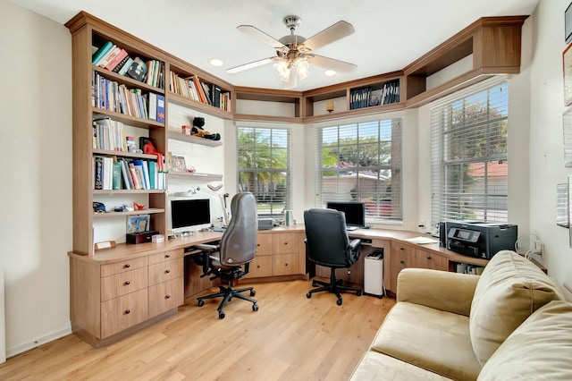 office space featuring light wood-style floors and a ceiling fan