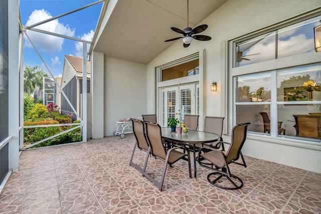 sunroom with lofted ceiling and ceiling fan