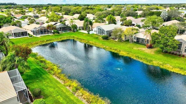 drone / aerial view featuring a residential view and a water view