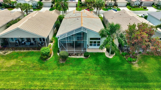 birds eye view of property with a residential view