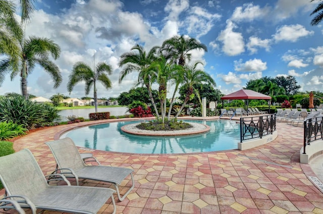 community pool with a patio area