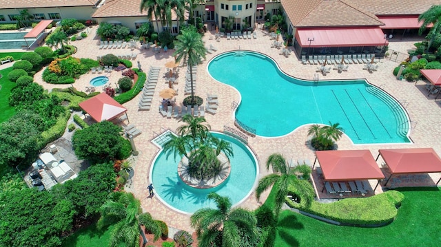 community pool featuring a patio area