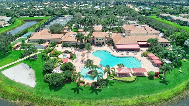 drone / aerial view featuring a residential view and a water view