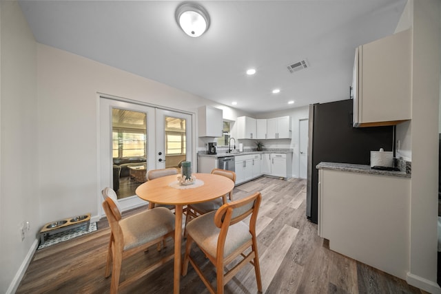 dining space featuring recessed lighting, visible vents, baseboards, light wood-style floors, and french doors