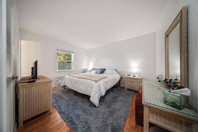 bedroom with wood finished floors