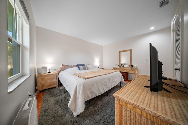 bedroom with carpet floors and visible vents