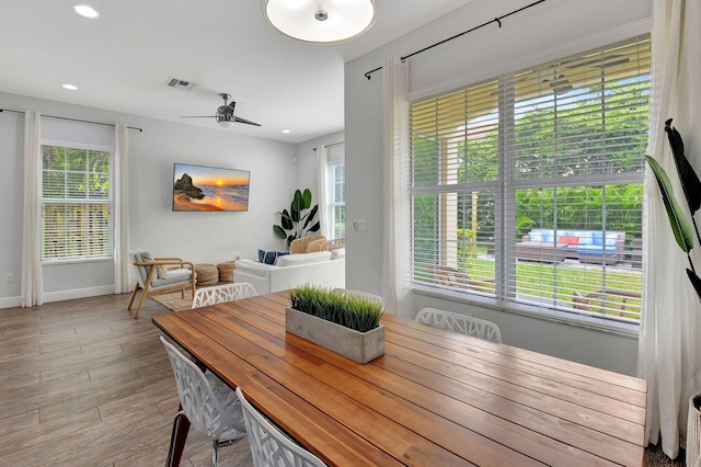 dining room with visible vents, baseboards, ceiling fan, light wood-type flooring, and recessed lighting