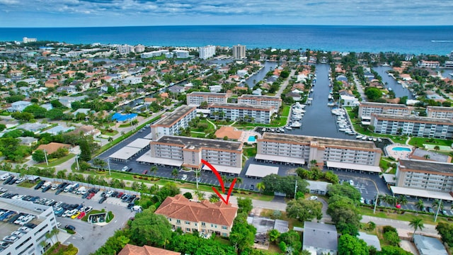 bird's eye view featuring a water view and a city view