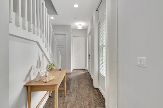 interior space with recessed lighting, dark wood-style flooring, baseboards, and stairs