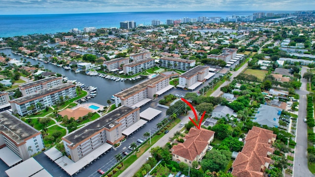 bird's eye view featuring a water view and a view of city