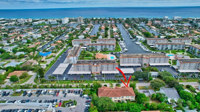 aerial view featuring a view of city and a water view