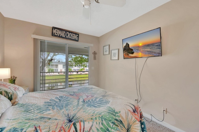 carpeted bedroom featuring access to exterior, baseboards, and a ceiling fan