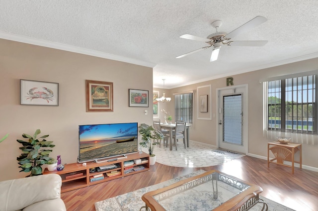 living room with crown molding and wood finished floors