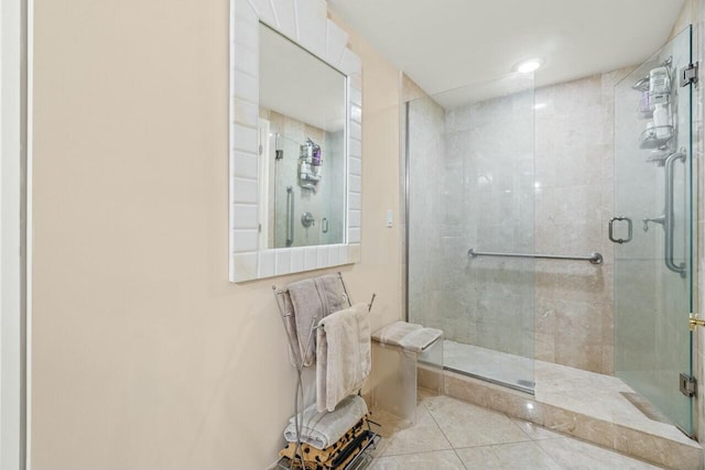 bathroom with tile patterned flooring and walk in shower