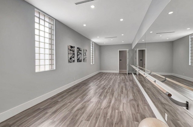 10079 Diamond Lake Rd, Boynton Beach, FL 33437 - unfurnished room with baseboards, wood finished floors, and recessed lighting