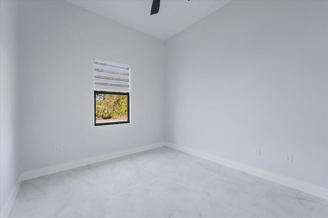 empty room with lofted ceiling and ceiling fan