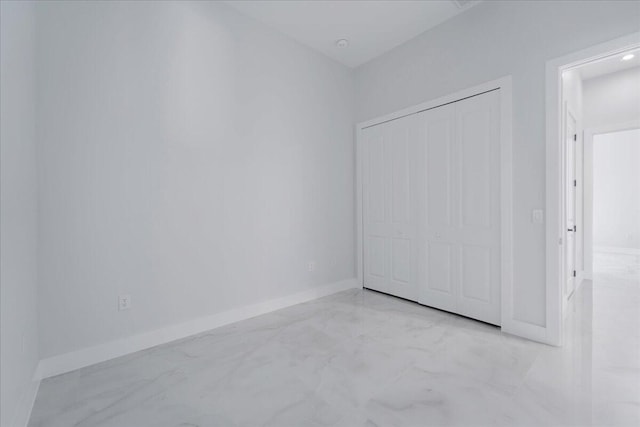 unfurnished bedroom featuring a closet