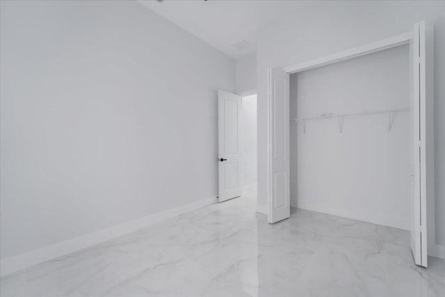 unfurnished bedroom with a closet