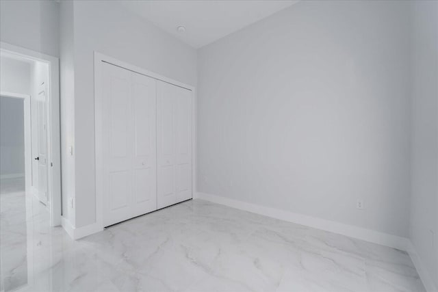 unfurnished bedroom with a closet