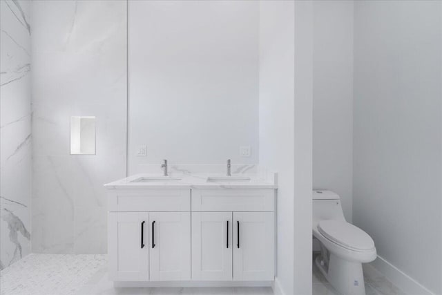 bathroom with toilet, vanity, and a shower