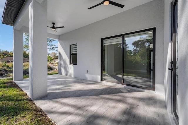 view of patio featuring ceiling fan