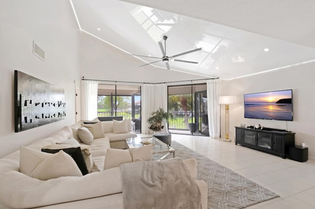 living room with ceiling fan, light tile patterned flooring, and high vaulted ceiling