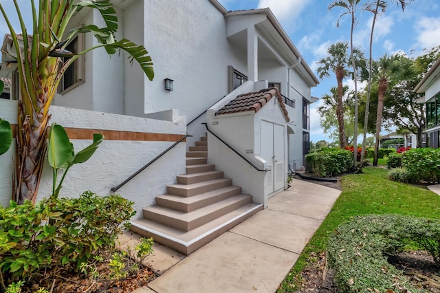 15334 Strathearn Dr Unit 12104, Delray Beach, FL 33446 - property entrance with stucco siding and a tiled roof