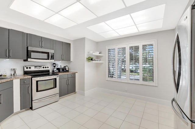 15334 Strathearn Dr Unit 12104, Delray Beach, FL 33446 - kitchen with appliances with stainless steel finishes, gray cabinets, light countertops, and open shelves