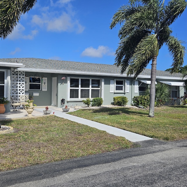 ranch-style house with a front yard