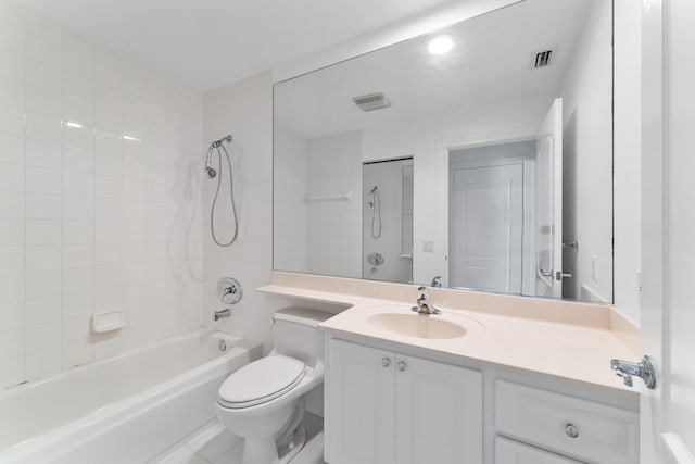 full bath featuring vanity, toilet, and shower / tub combination