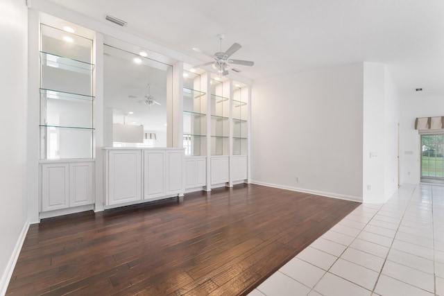 empty room featuring ceiling fan, wood-type flooring, baseboards, and recessed lighting