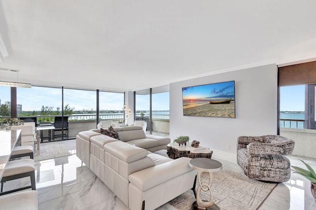 living room featuring a water view and expansive windows