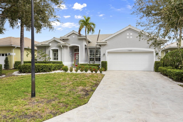 single story home featuring a front lawn and a garage