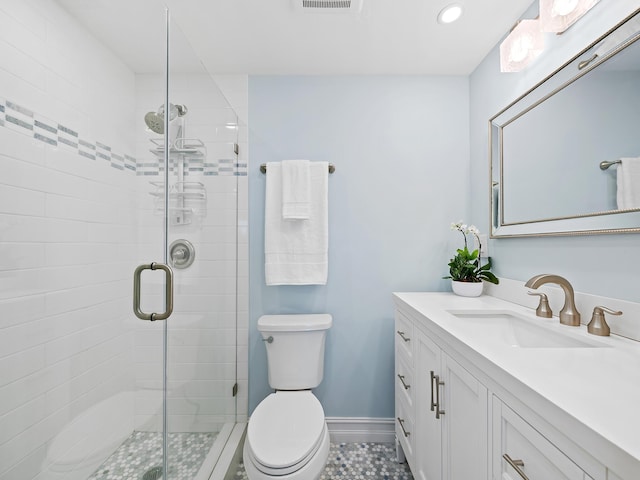 bathroom with vanity, an enclosed shower, and toilet