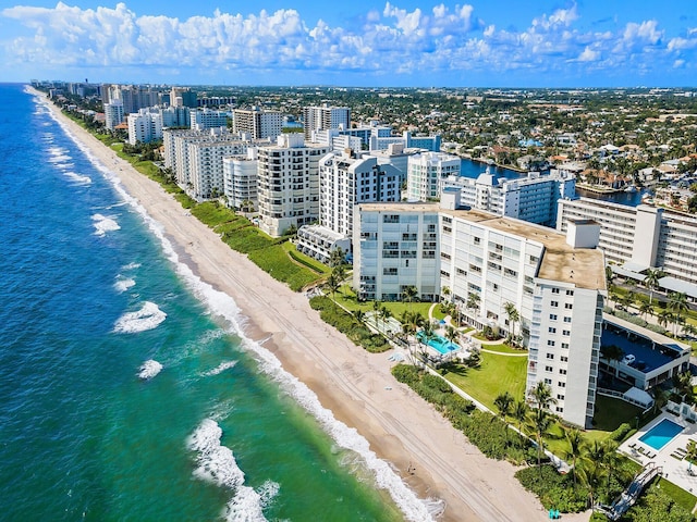 aerial view with a water view and a view of the beach