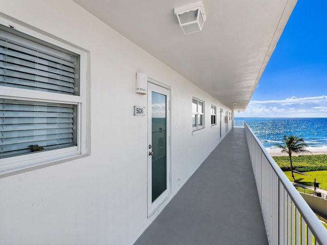 balcony featuring a water view