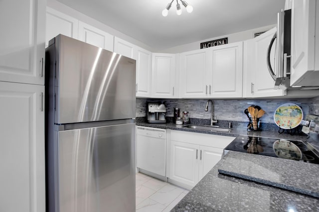 kitchen with marble finish floor, stainless steel appliances, a sink, and white cabinetry