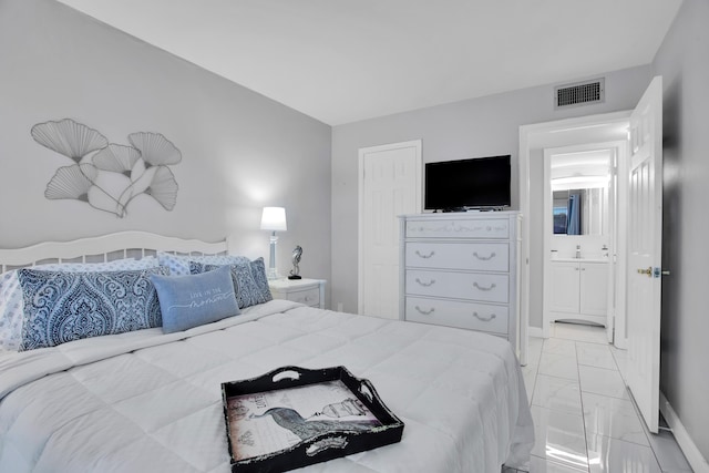 bedroom with marble finish floor, visible vents, and baseboards