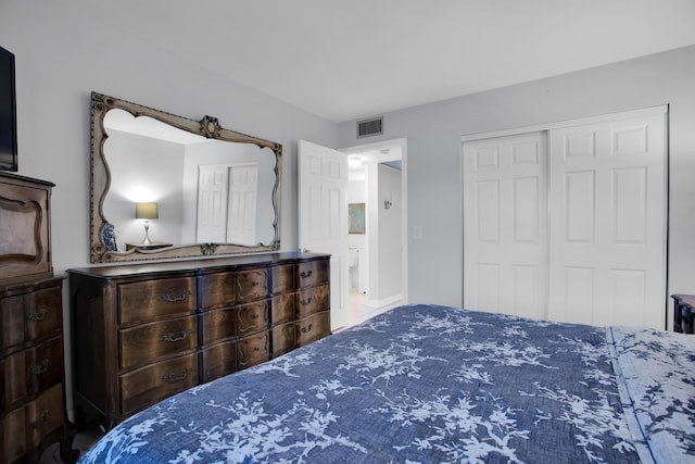 bedroom with a closet and visible vents