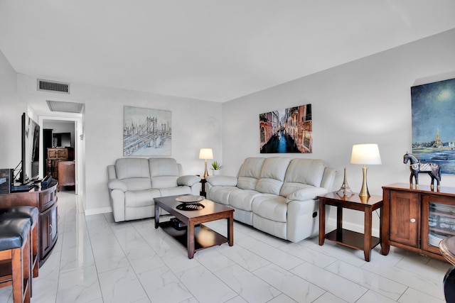 living area with marble finish floor, baseboards, and visible vents