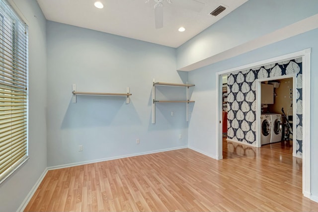 walk in closet with ceiling fan, light wood-type flooring, independent washer and dryer, and visible vents