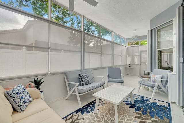 sunroom / solarium with a ceiling fan