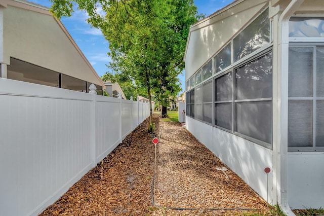view of home's exterior featuring fence