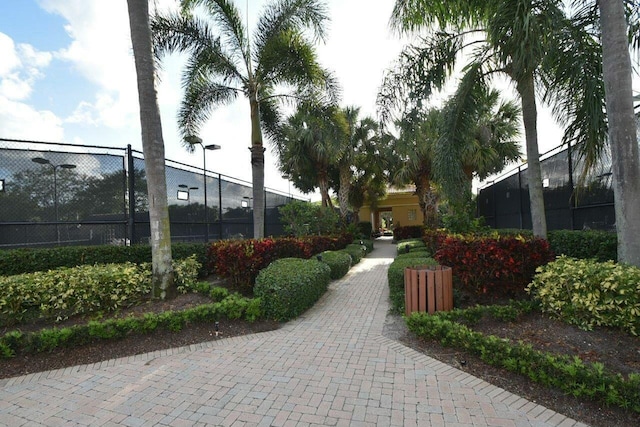 view of home's community with fence