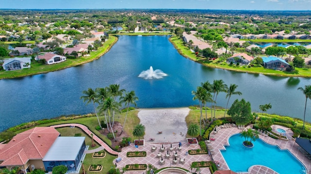 drone / aerial view featuring a residential view and a water view