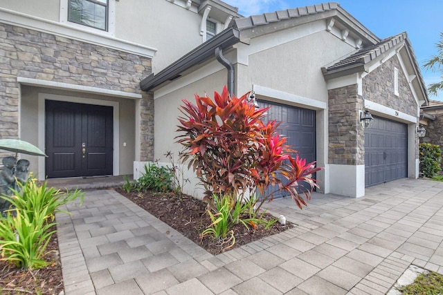 property entrance with a garage