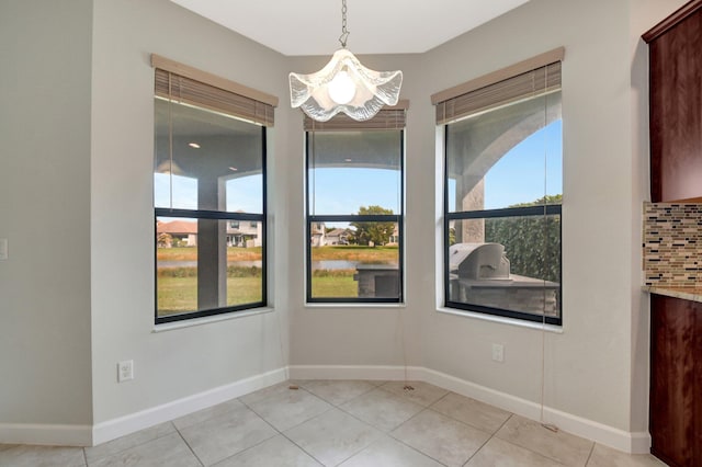 unfurnished room with light tile patterned floors