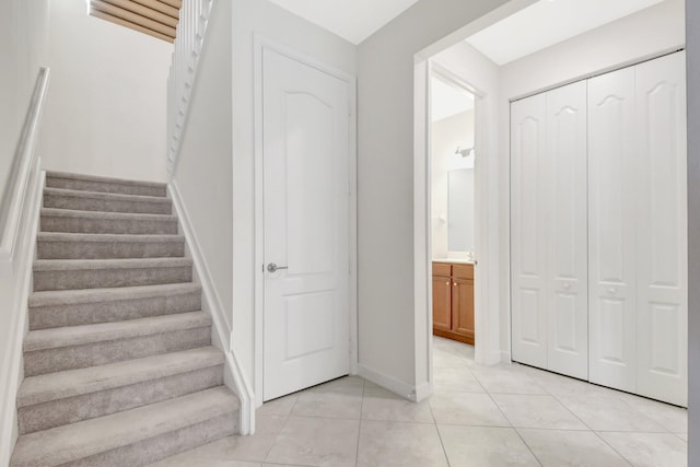 staircase with tile patterned floors