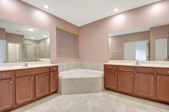 bathroom featuring tile patterned floors, separate shower and tub, and vanity